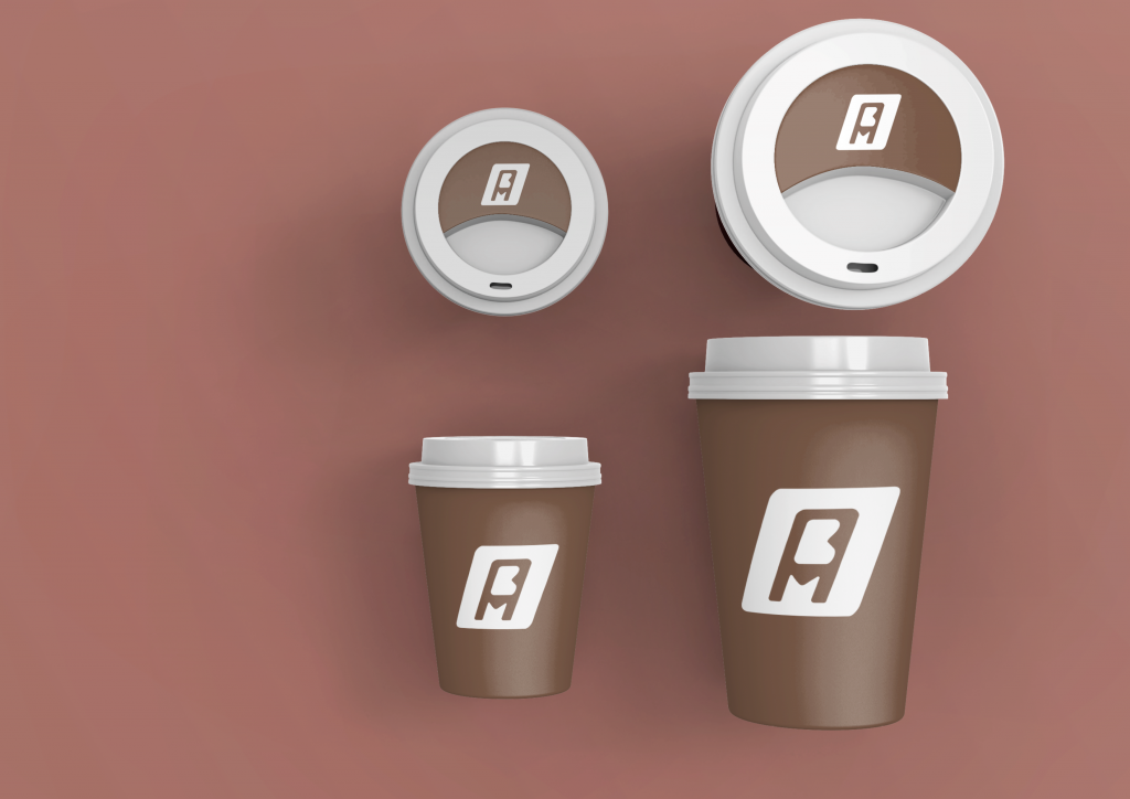 Mockup d’un gobelet de café marron avec le logo blanc de Marina ANASSOU, créateur digital.
